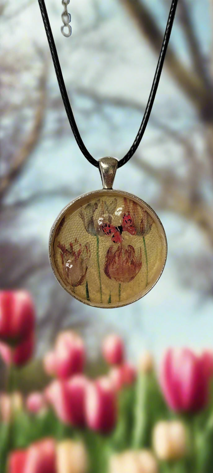 Necklace with a round pendant featuring floral design on a white background