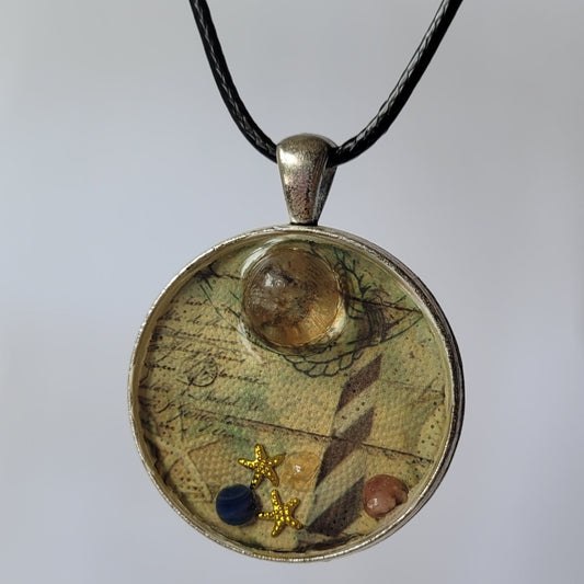 Necklace with a circular pendant featuring lighthouse design on a white background