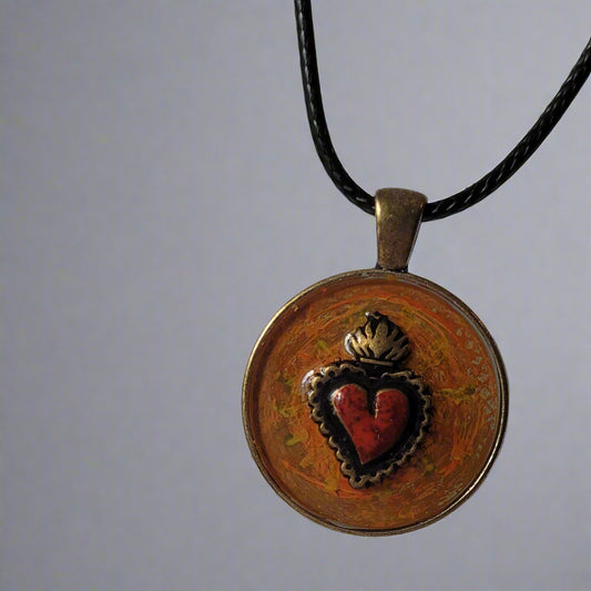 Necklace with a round pendant featuring a heart design on a white background