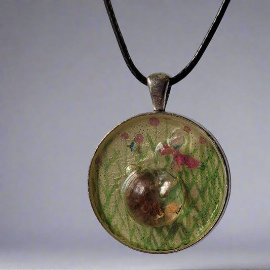 Decorative pendant with floral design on a white background